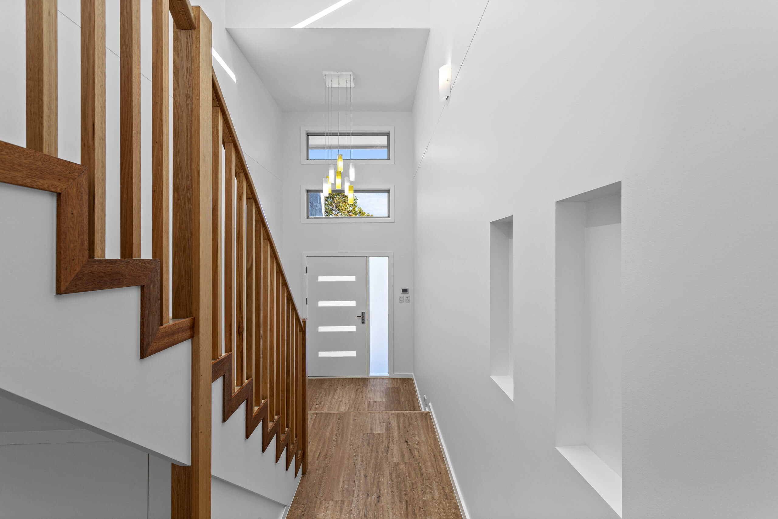 new home build with star case in entryway