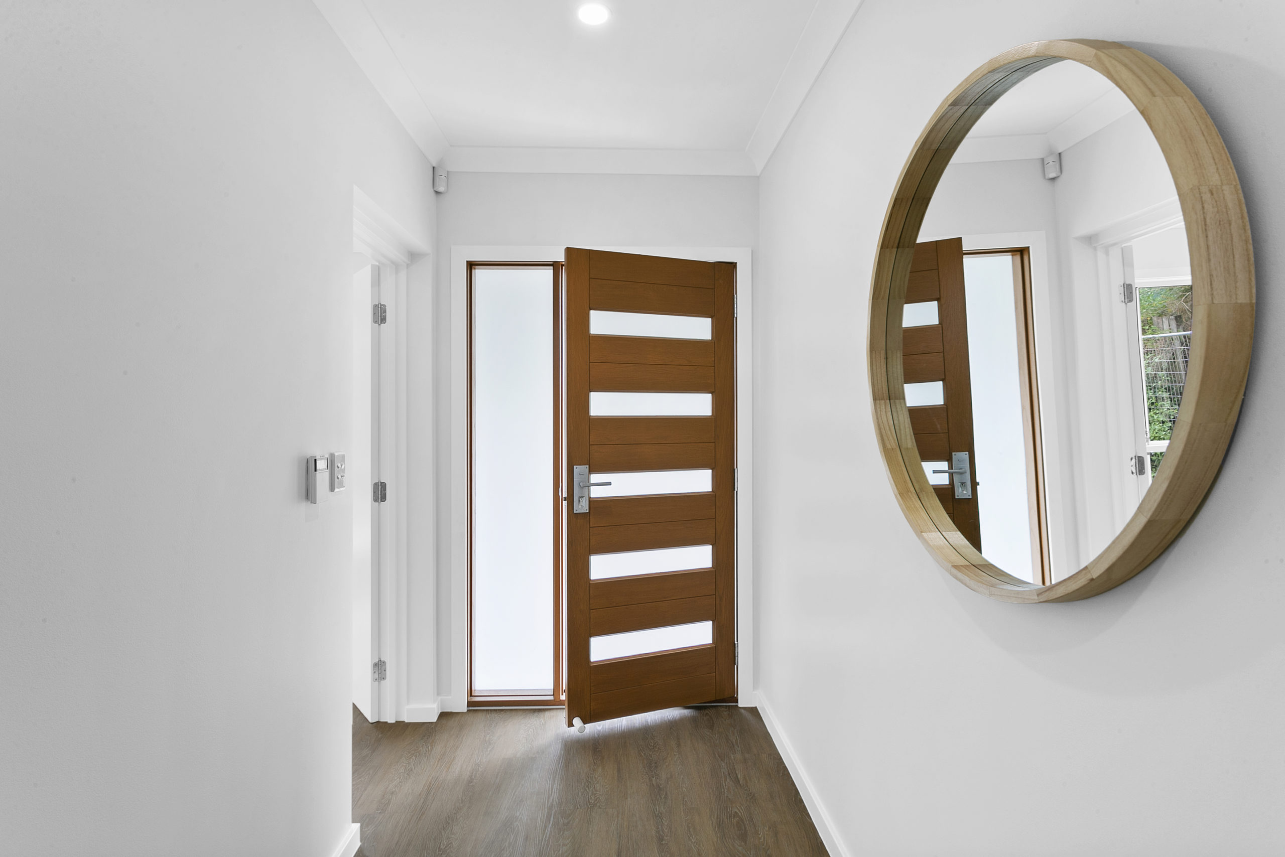 A door opening to the entry of a new home built in sydney