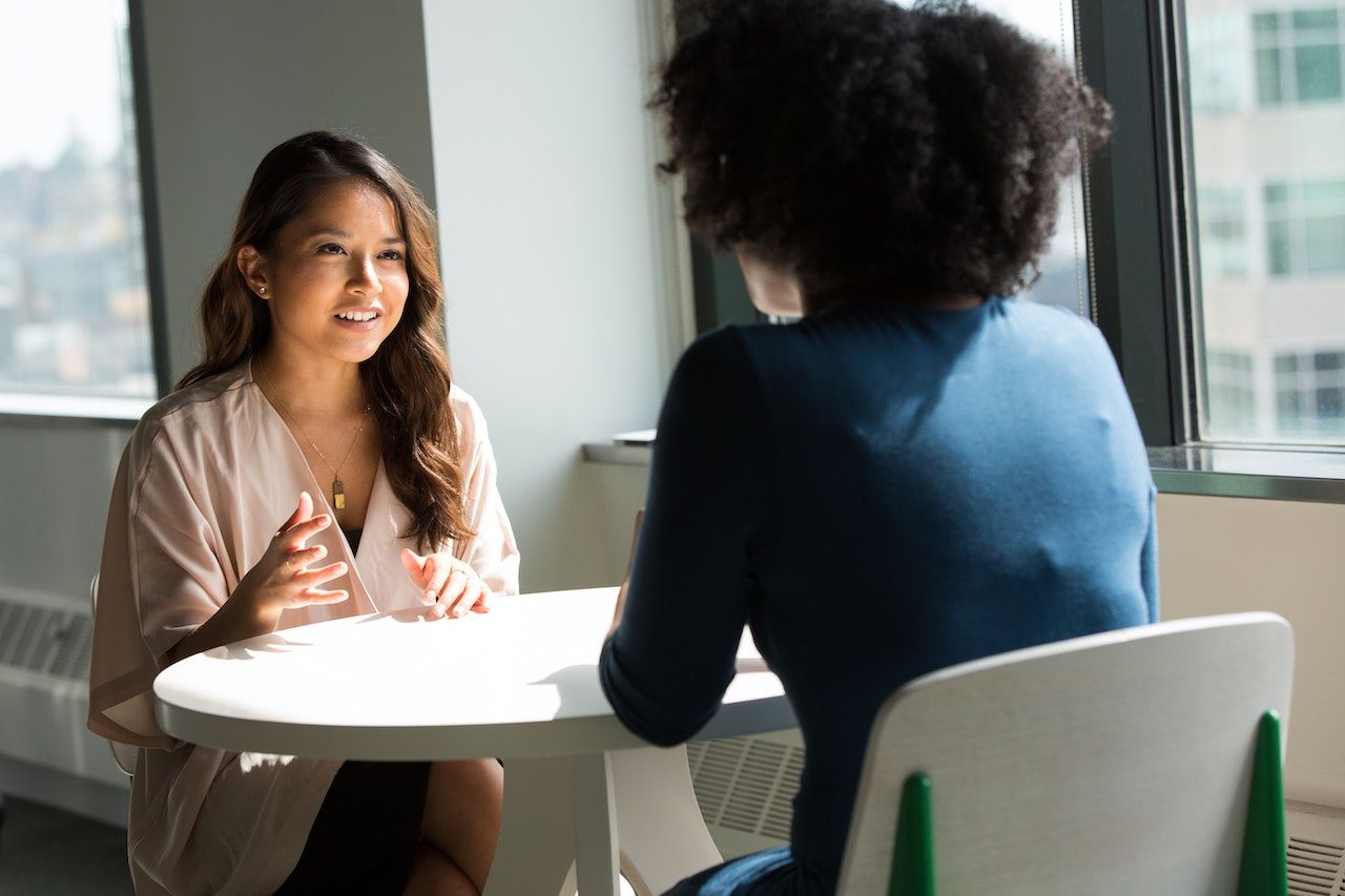 Two business women talking